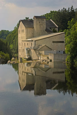 the mill and its reflection in the river