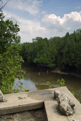 a lookout with stone parapet offers a view of the river below