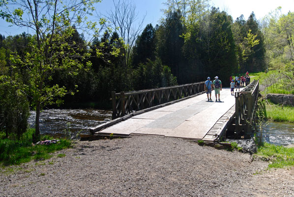 people crossing the bridge