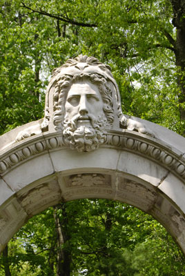 a stone head above an archway