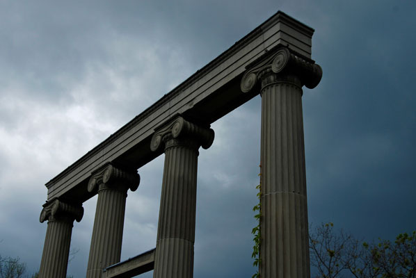 the sky beyond a row of columns