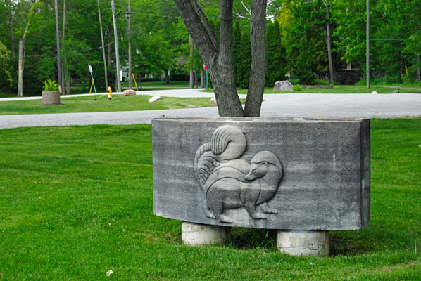 skunk bas-relief on a lawn at Guild Park and Gardens