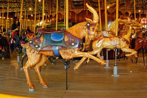 a goat with colourful saddle and trappings and other animals on the carousel at Lakeside Park, Port Dalhousie, St. Catharines